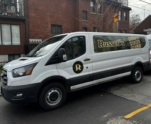 Vinyl branding applied to a work van for Russells